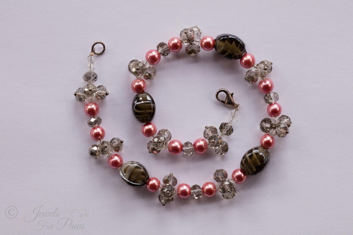 cat dog pet necklaces jewelry, smoky gray lampwork glass beads with pink pearl beads and smoked glass czech crystal clusters on a white background