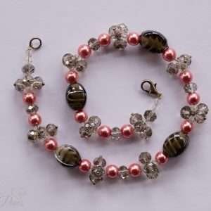 cat dog pet necklaces jewelry, smoky gray lampwork glass beads with pink pearl beads and smoked glass czech crystal clusters on a white background