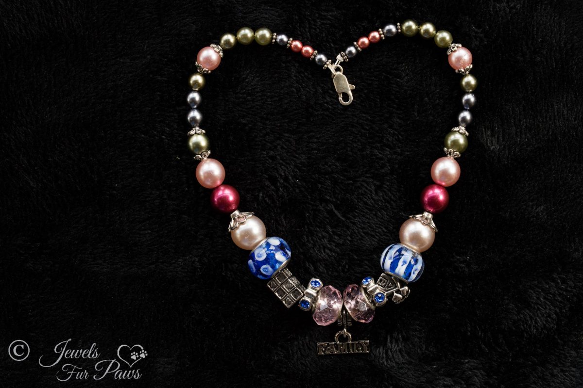large pink faceted czech crystals with rhinstone rhondells, blue murano glass beads, pink pearls, gray pearls on black background
