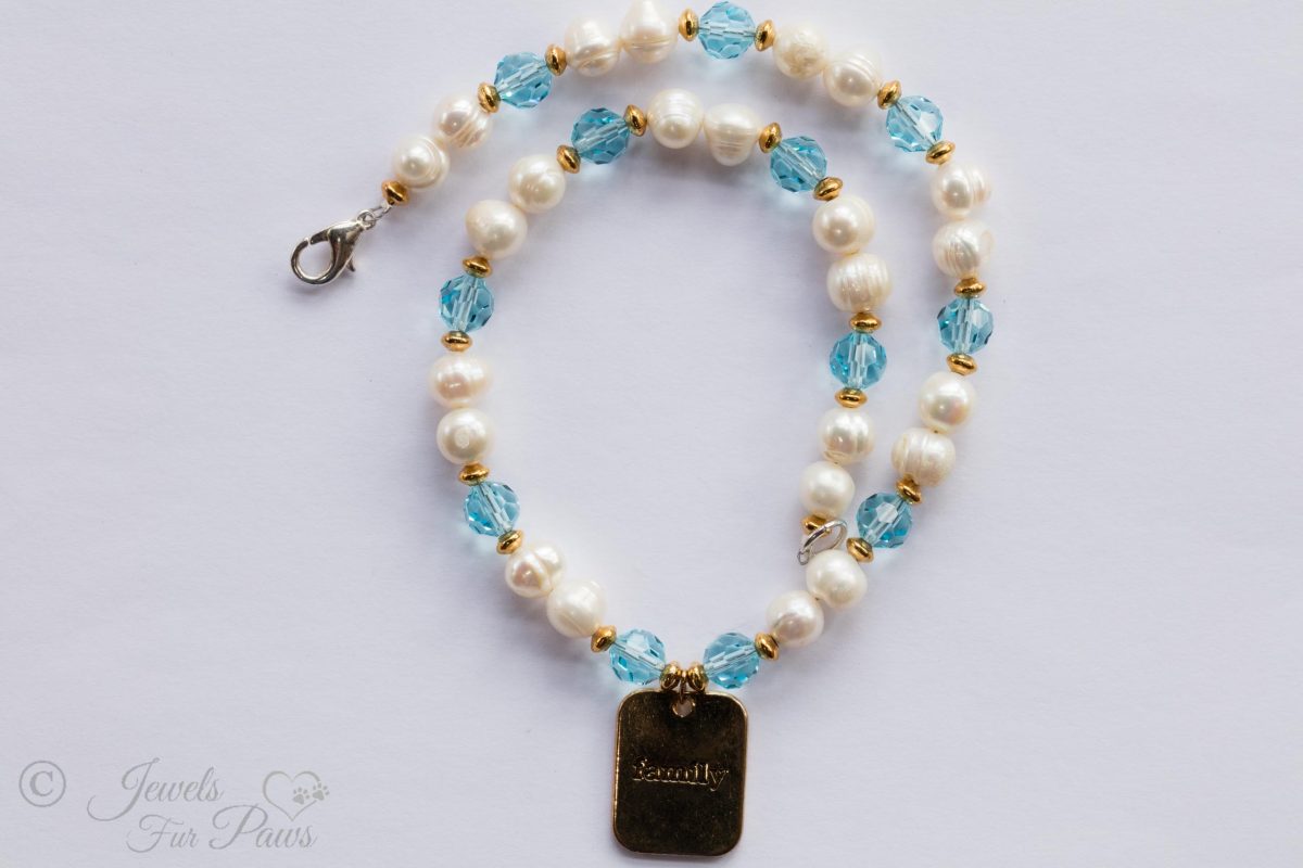 dog cat pet necklaces jewelry, sets of two cultured pearls with pale blue aquamarine czech crystals with hanging brass family charm pendant on white background