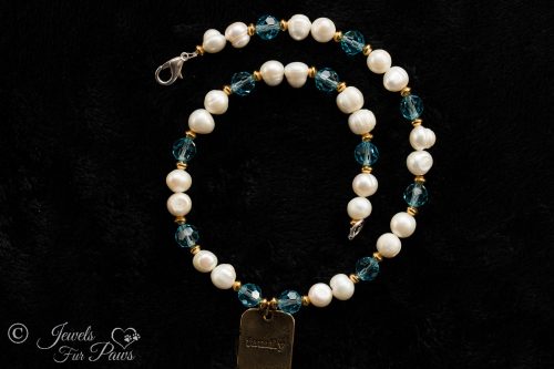 dog cat pet necklaces jewelry, sets of two cultured pearls with pale blue aquamarine czech crystals with hanging brass family charm pendant on black background