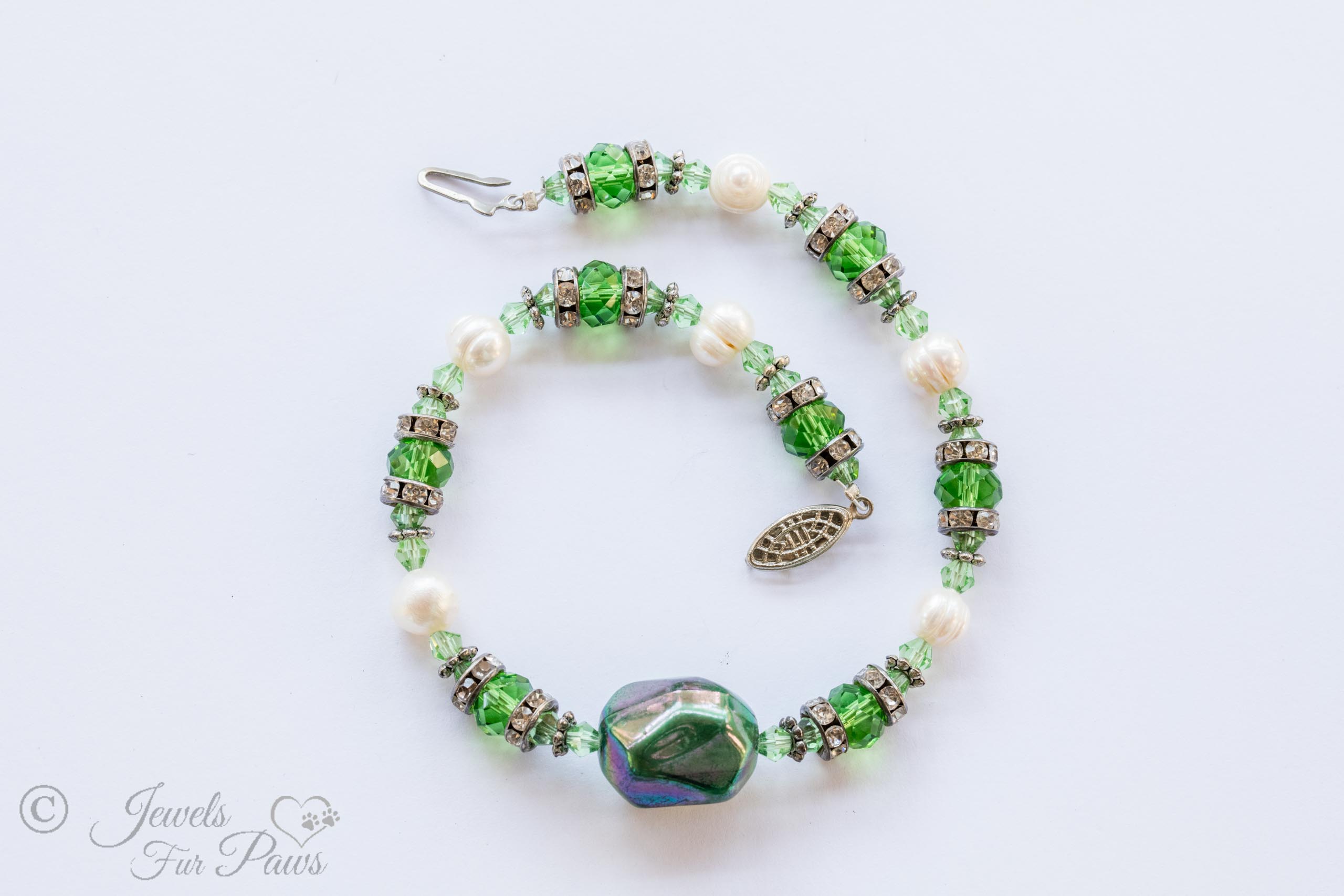 iridescent green bauble bead with green Czech crystals, cultured pearls, channel set rhinestone separators for small dogs, cats on white background