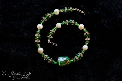 iridescent green bauble bead with green Czech crystals, cultured pearls, channel set rhinestone separators for small dogs, cats on black background