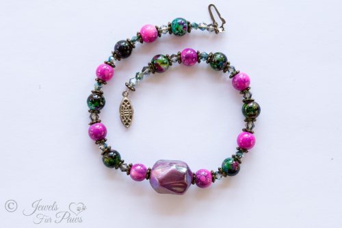 dog cat pet necklace with large irregular purple bauble bead purple marbleized beads green marbleized beads swarovski crystals and silver spacers on white background