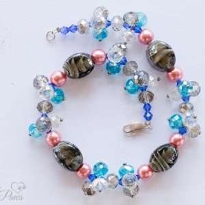 dog cat pet necklace with light black darck gray oval lampwork swirled beads and multi colored crystal crystal beads on white background