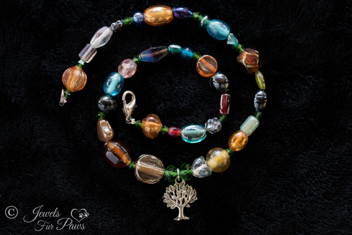 dog cat pet necklace tree of life charm multi colored irregular beads orange brown green blue red on black background