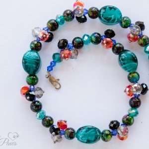 dog cat pet necklace with oval blue lampwork glassbeads and multi colored marbleized beads with clusters of swarovski crystal beads on white background