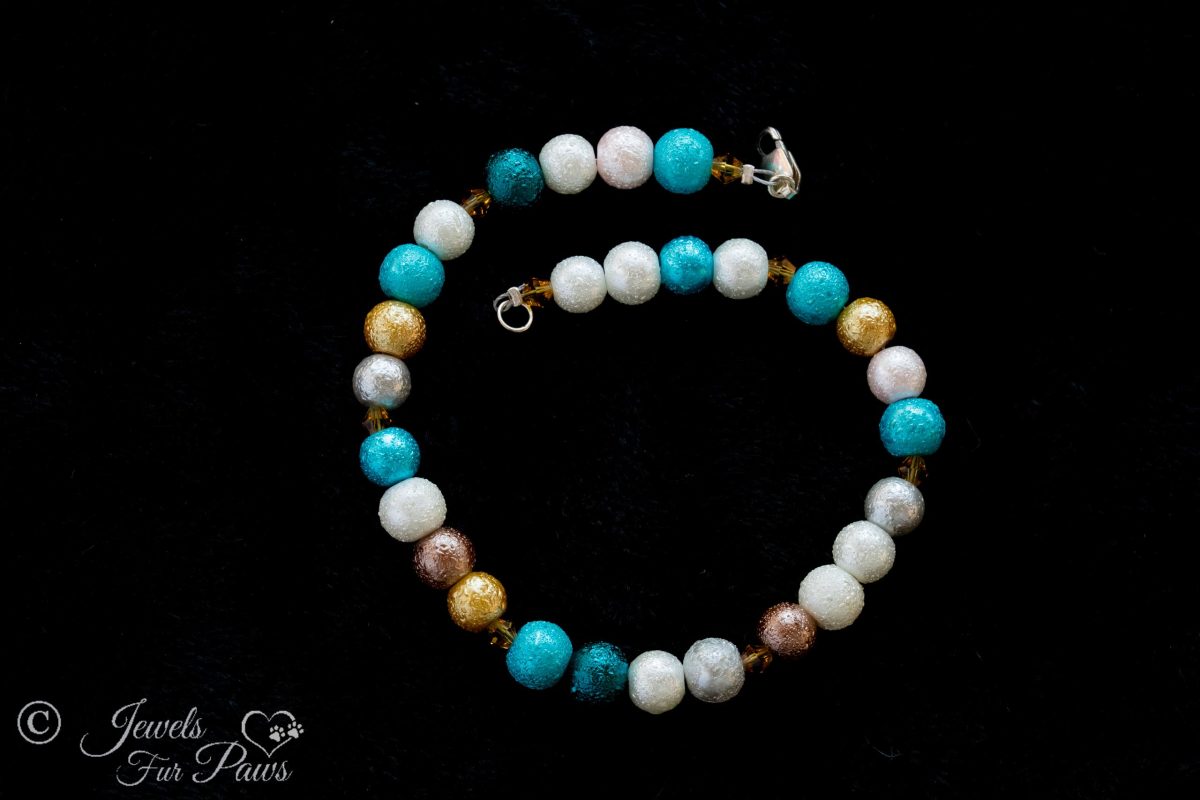 dog cat pet necklace hammered silver beads gold beads white beads turquoise beads swarovski crystal spacers on black background