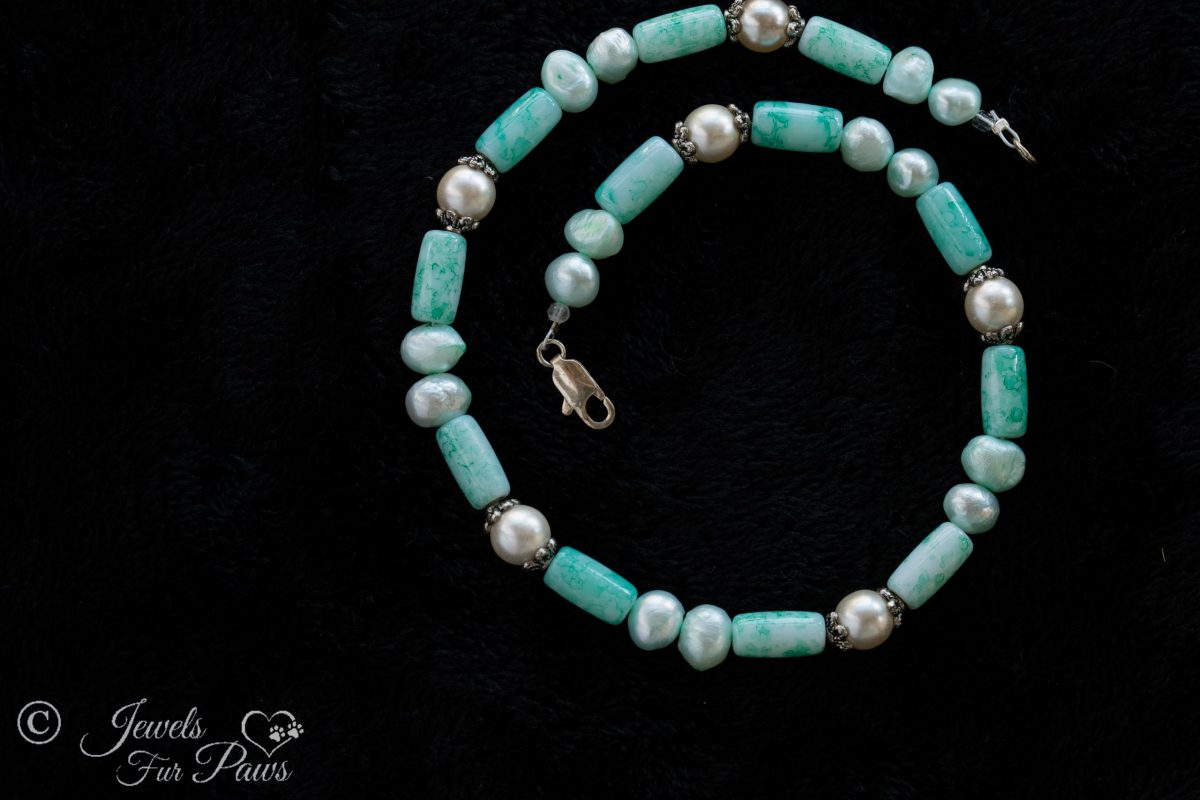 dog cat pet necklace with aqua turquoise barrel beads with pearl beads and aqua cultured pearls surrounded by silver spacers on black background