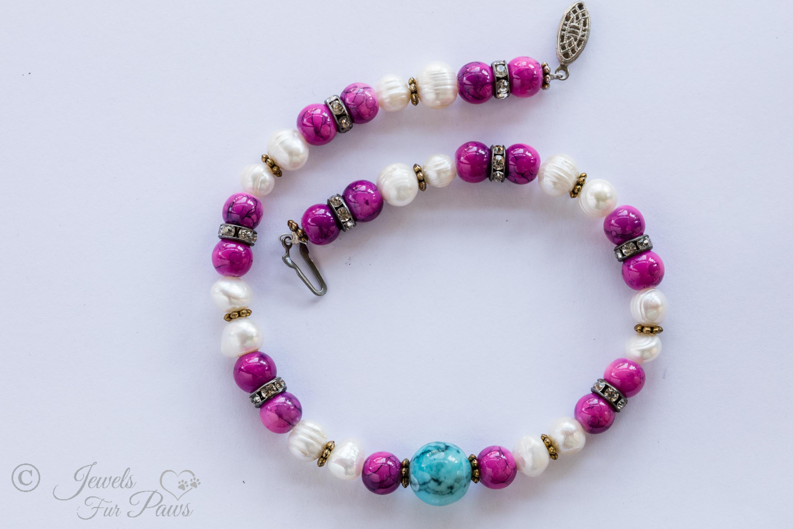dog cat pet necklace baroque pearls fuschia pink marbleized beads swarovski crystal spacers and large turquoise marble bead in center on white background