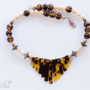 vintage Japanese cultured pearls with tigers eye tortoise shell beads and tortoise shell "piano" graduated flat beads on black background