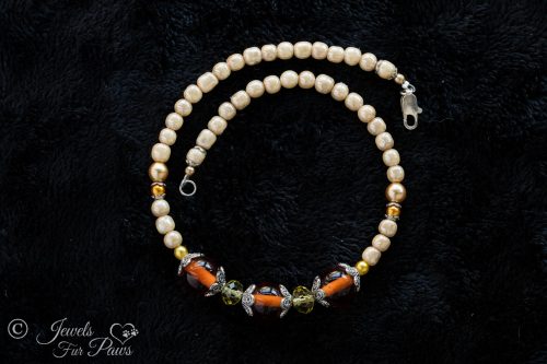 dog cat pet necklace vintage japanese round amber glass beads with baroque pearls swarovski crystals and silver spacers on a black background