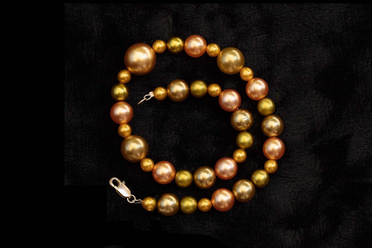 gold pearls on black background