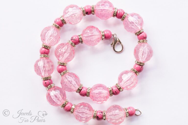 large pale pink faceted Czech crystals with smaller marbleized pink beads and channel set rhinstone spacers on a white background pet dog cat jewelry necklaces