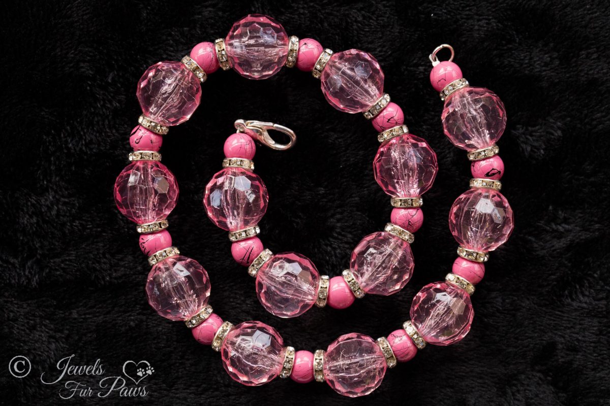 large pale pink faceted Czech crystals with smaller marbleized pink beads and channel set rhinstone spacers on a white background pet dog cat jewelry necklaces