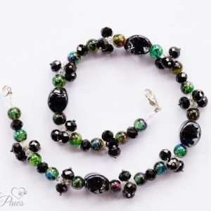 large black oval glass beads with clusters of black faceted Czech crystal and marble green beads on white background for medium dogs pet jewelry