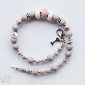 pale lavender round beads with silver rhondell spacers and faceted crystals on white background