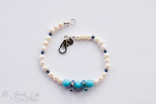 cultured pearls with small blue spacers and three turquoise beads with large swarovski crystal spacers on white background