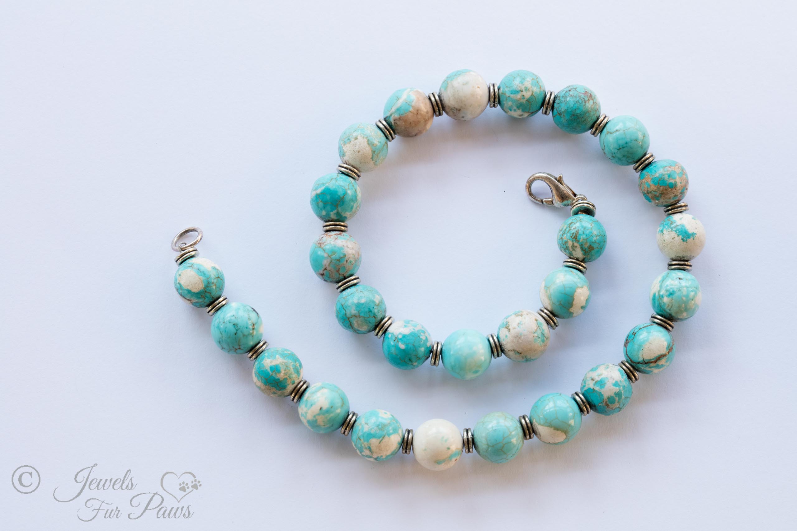 tumbled turquoise beads with silver spacers medium dog necklace on white background