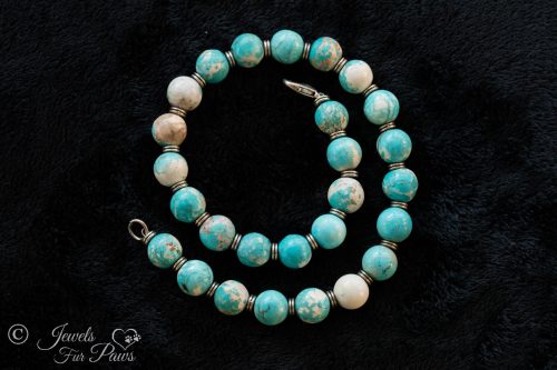 tumbled turquoise beads with silver spacers medium dog necklace on black background