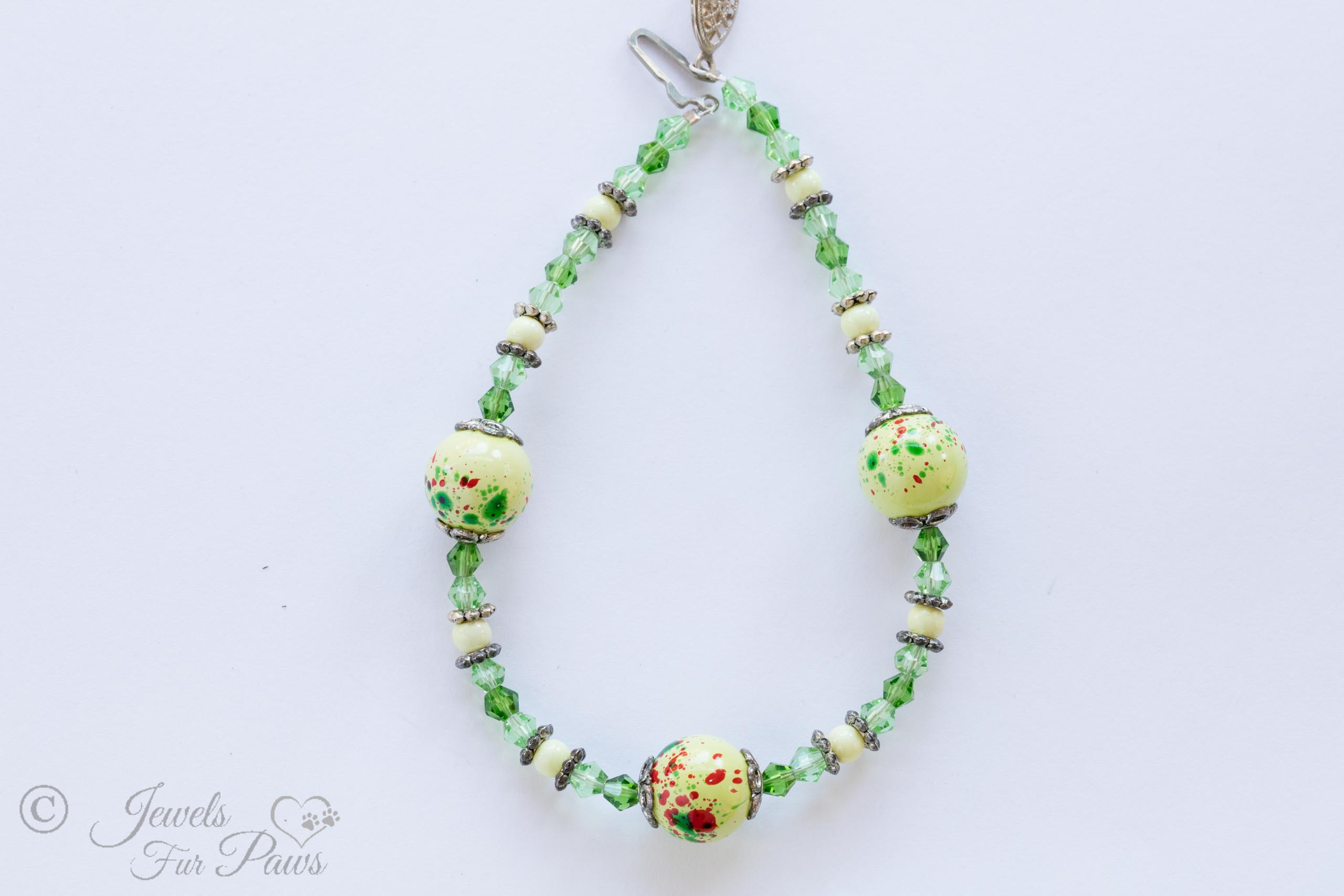 3 large speckled light green beads with faceted green crystals, white beads, and silver spacers for extra small dogs and cats