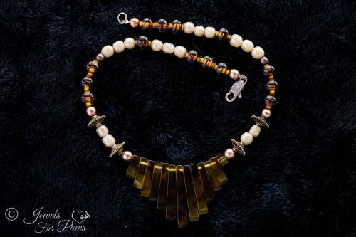 vintage Japanese cultured pearls with tigers eye tortoise shell beads and tortoise shell "piano" graduated flat beads on black background