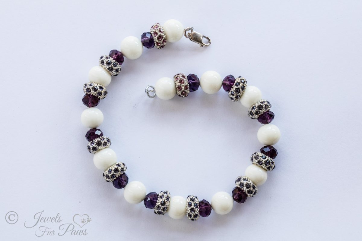 white beads with purple faceted crystals and amethyst Swarovski studded spacers