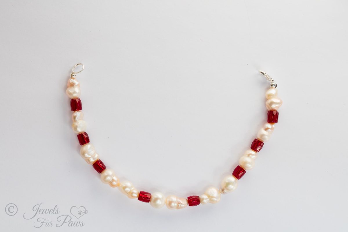 natural pearls with red crystal barrel beads on white background small dog cat necklace
