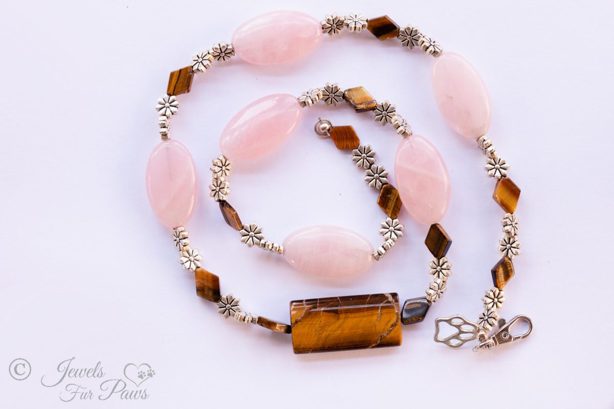 dog cat pet necklaces jewelry, pink agate oval stones and diamond shaped tigers eye beads with silver flower spacers and large tigers eye barrel bead on white background