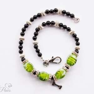 cat dog pet medium necklace four green lampwork glass beads with black onyx beads and fluted silver rondel spacers with channel set swarovski crystals on white background