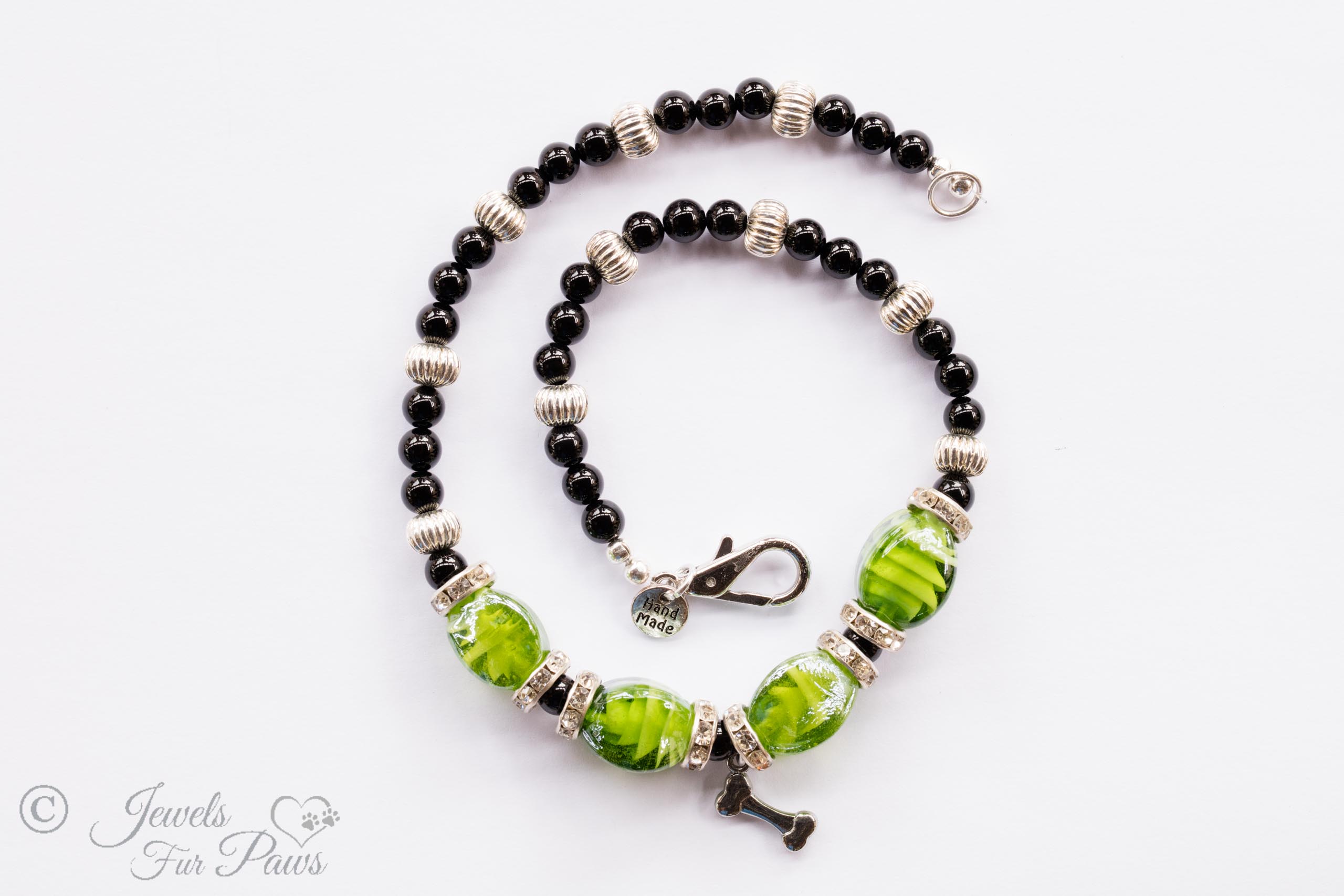 cat dog pet medium necklace four green lampwork glass beads with black onyx beads and fluted silver rondel spacers with channel set swarovski crystals on white background
