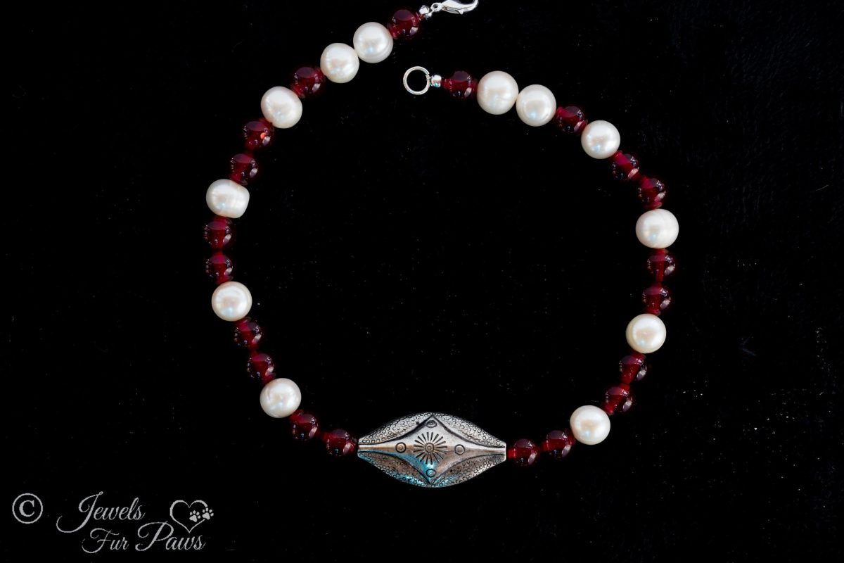 medium cat dog pet necklace with silver indian style vintage center beads with freshwater pearls and red carnelians on a black background