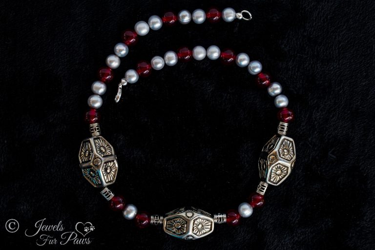 large dog cat pet necklace featureing three large silver indian style beads with freshwater pearls and red carnelians and filigree silver spacers on a black background