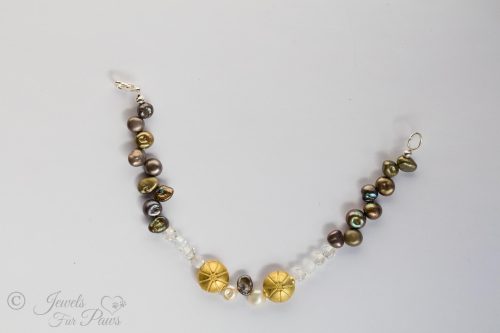 extra small pet necklace featuring different colored cultured freshwater pearls and czech crystals with 2 antique gold plated beads on a white background