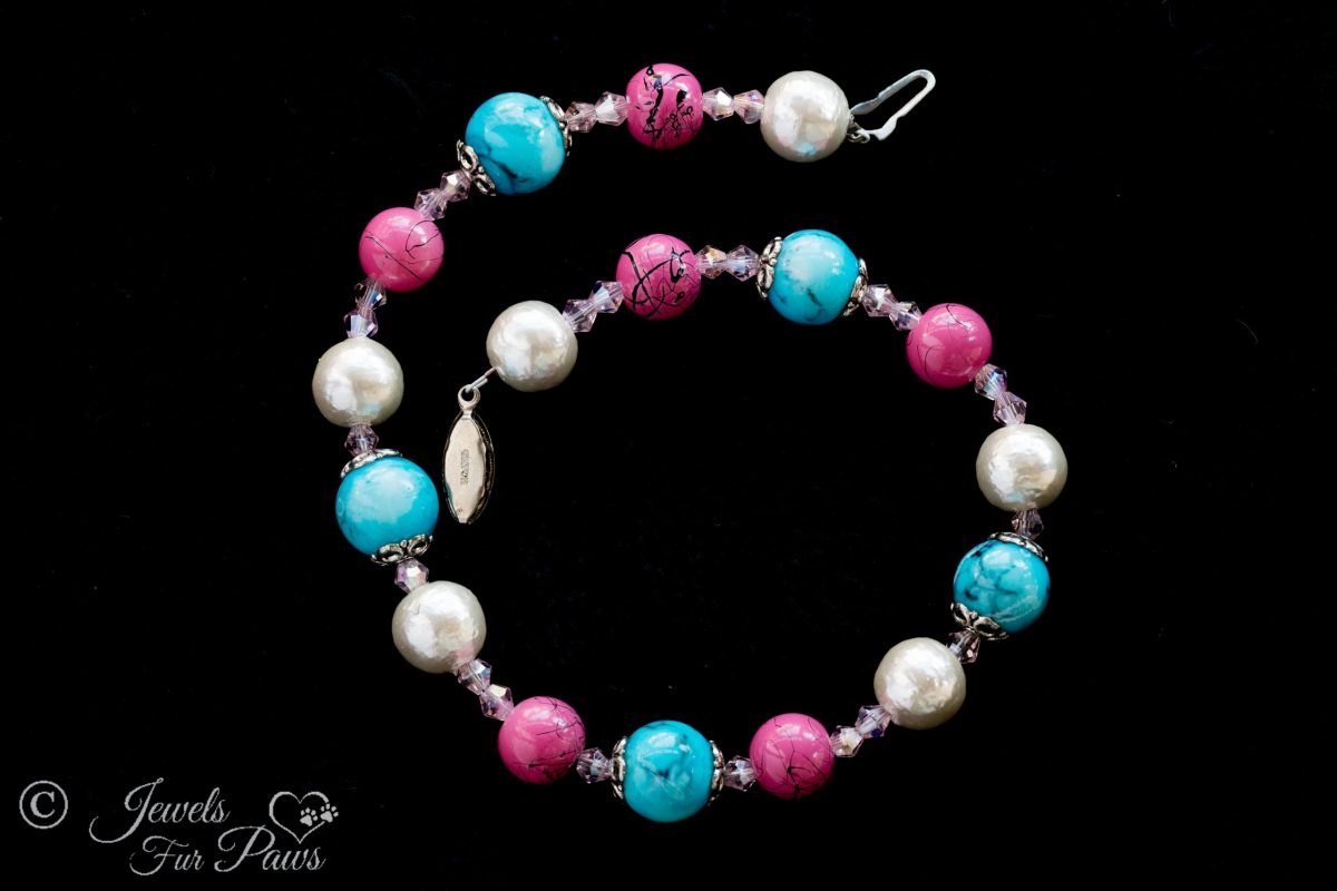 dog cat pet necklace pink speckled beads, turquoise beads, pearl bead spacers on black background