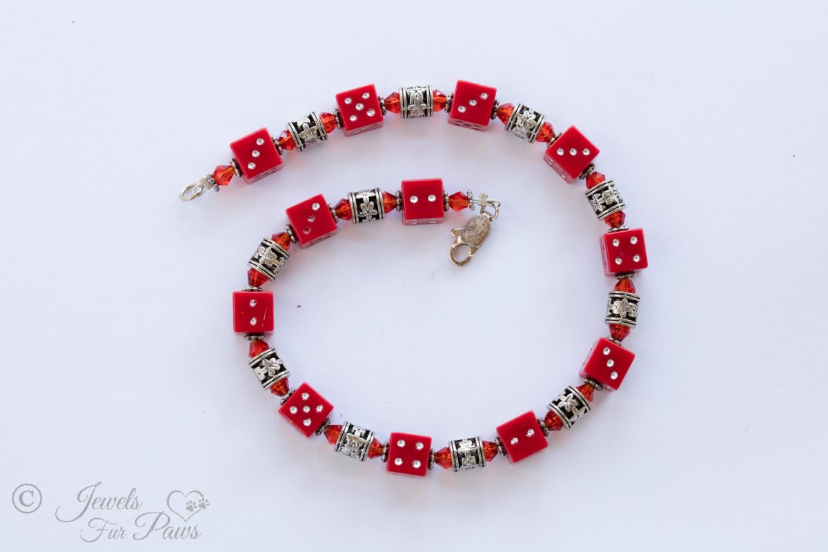 dog cat pet necklace jewelry featuring four sided red dice with red czech crystal spacers and silver flour filigree spacer beads on white background
