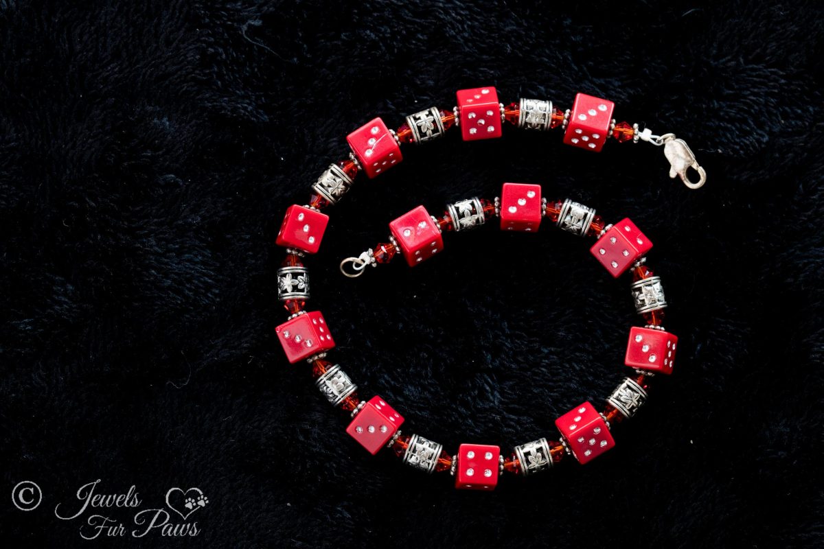 dog cat pet necklace jewelry featuring four sided red dice with red czech crystal spacers and silver flour filigree spacer beads on black background
