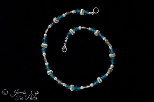 large cat dog pet necklace with light aqua blue czech crystal beads fluted silver rondel spacers and silver fish spacers on black background