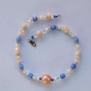 cat dog pet necklace large salmon orange bead with cats eye blue and white beads on white background