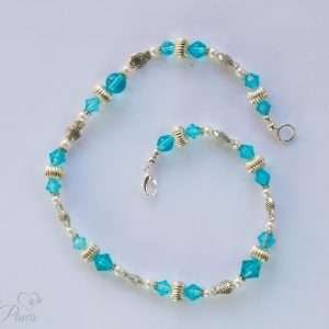 large cat dog pet necklace with light aqua blue czech crystal beads fluted silver rondel spacers and silver fish spacers on white background