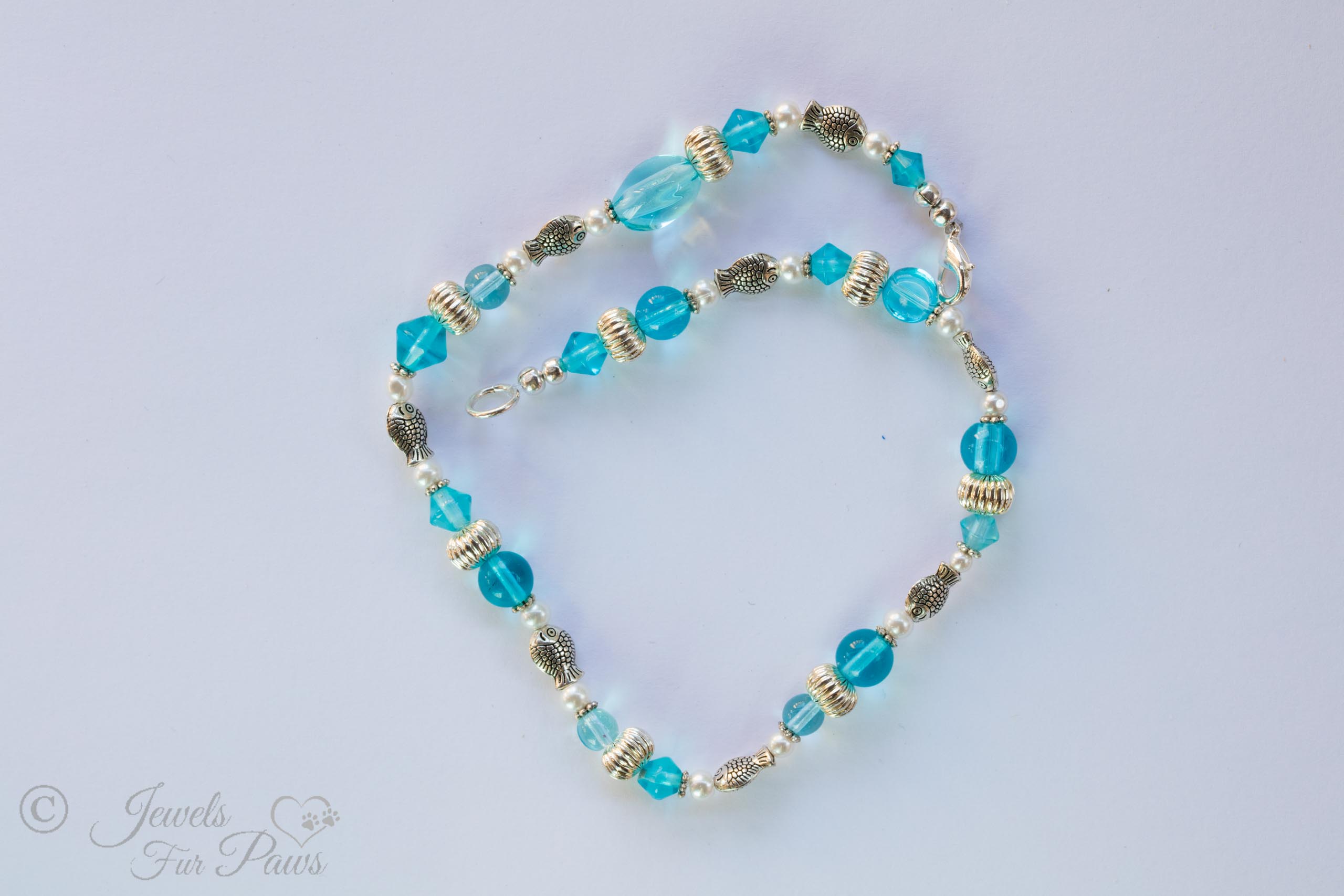 pet necklace with Silver rhondelles , silver fish spacers, and transparent robin blue beads