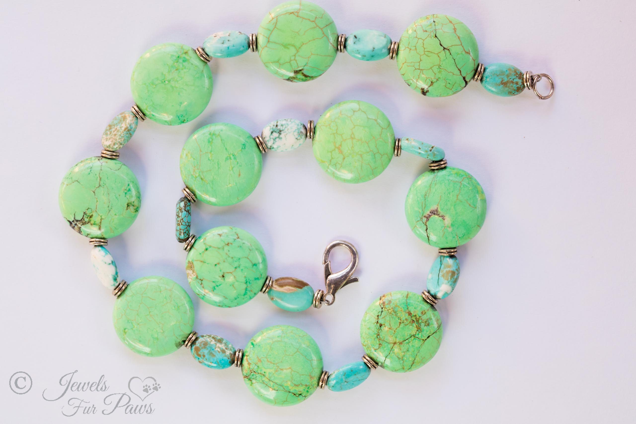 Green Turquoise necklace with blue turquoise spacers on white background