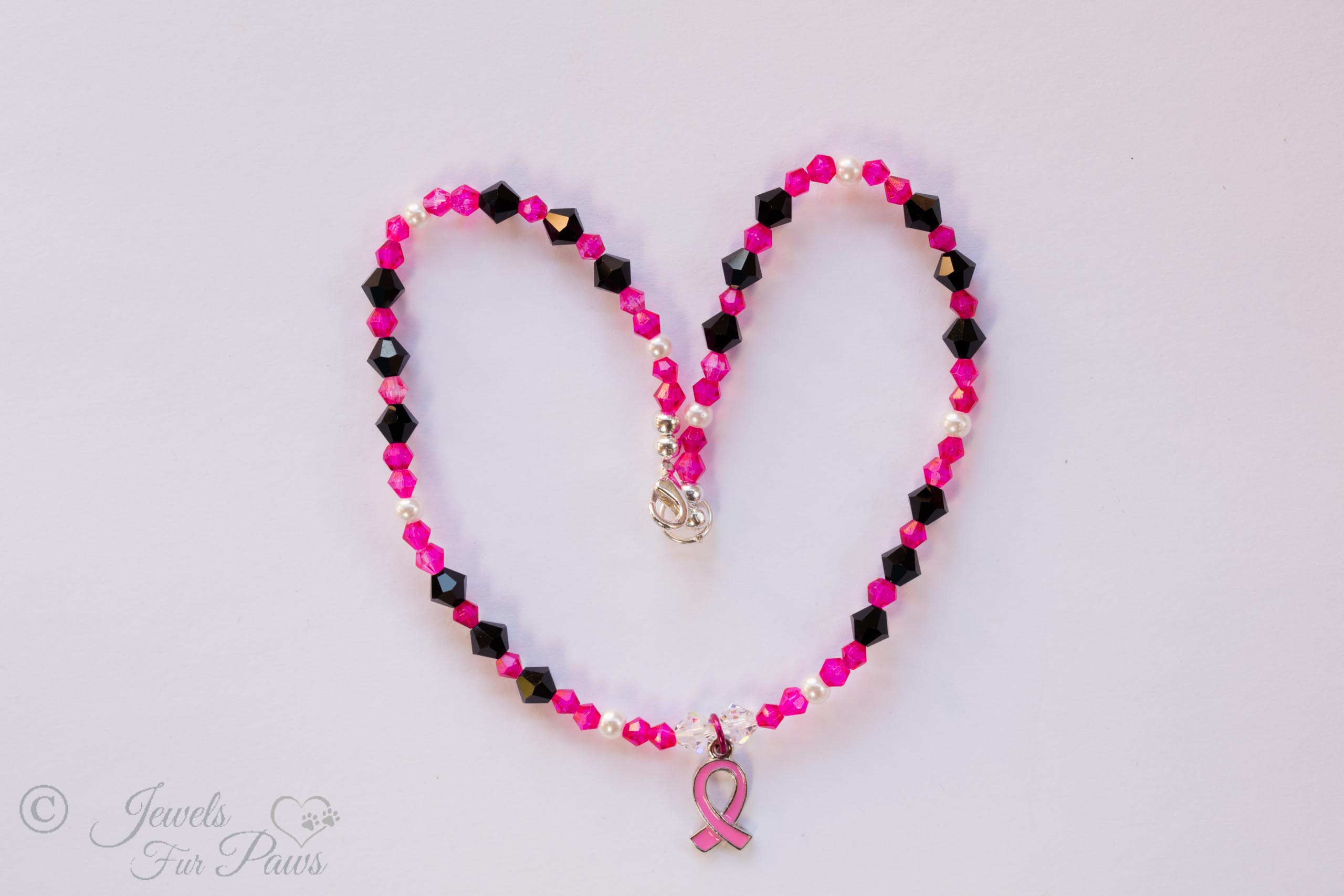 cat dog pet necklace breast cancer awareness hot pink and black crystals with hanging breast cancer ribbon pendant charm on white background