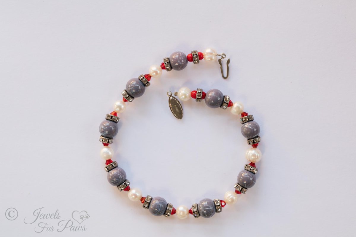 cat dog pet necklace marbleized blue beads with cultured pearls red crystals and swarovski crystal channel set spacers on white background