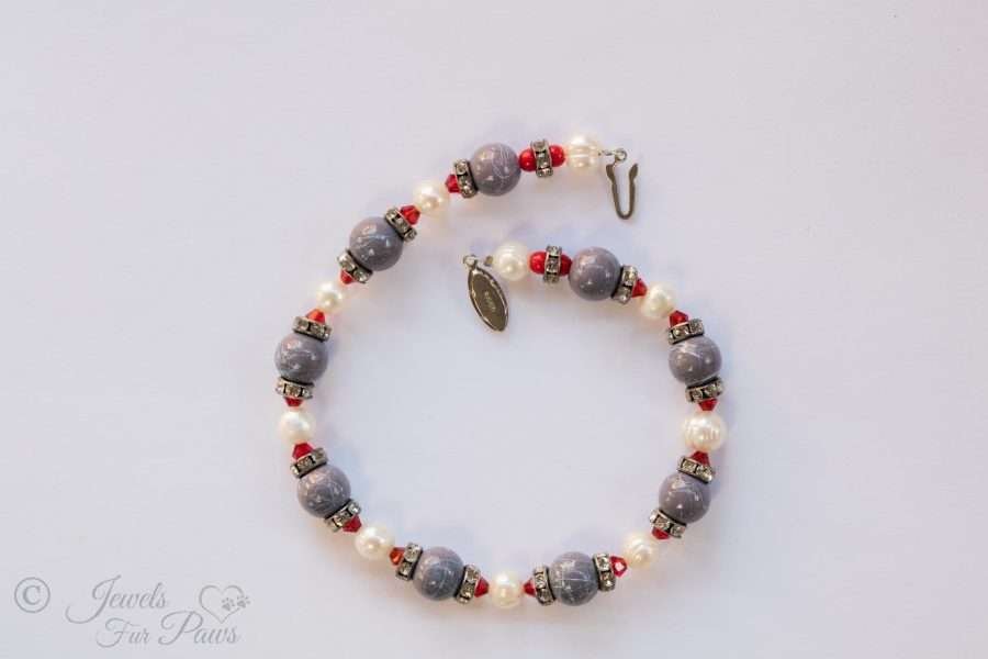 cat dog pet necklace marbleized blue beads with cultured pearls red crystals and swarovski crystal channel set spacers on white background