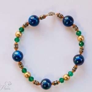 small cat dog pet necklace large blue beads with gold beads emerald crystal spacers and filigree silver spacers on a white background