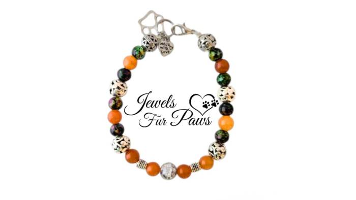 Handcrafted Pet Sacral Chakra Necklace featuring orange calcite crystals, silver spacers, and a heart and paws charm. Designed to promote emotional balance, grounding, and healing for pets