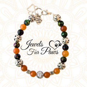 Handcrafted Pet Sacral Chakra Necklace featuring orange calcite crystals, silver spacers, and a heart and paws charm. Designed to promote emotional balance, grounding, and healing for pets
