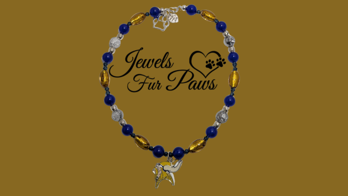 Handcrafted Minnesota Vikings pet collar with purple and gold beads, official NFL logo charm, and chakra-inspired gemstones for dogs or cats.