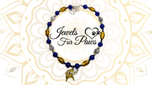 Handcrafted Minnesota Vikings pet collar with purple and gold beads, official NFL logo charm, and chakra-inspired gemstones for dogs or cats.